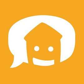 Ein l&auml;chendes Haus. Das Logo des Vereins "WOHN:SINN"